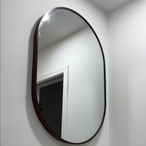 Elegant Oval Wall Mirror with Brown Frame